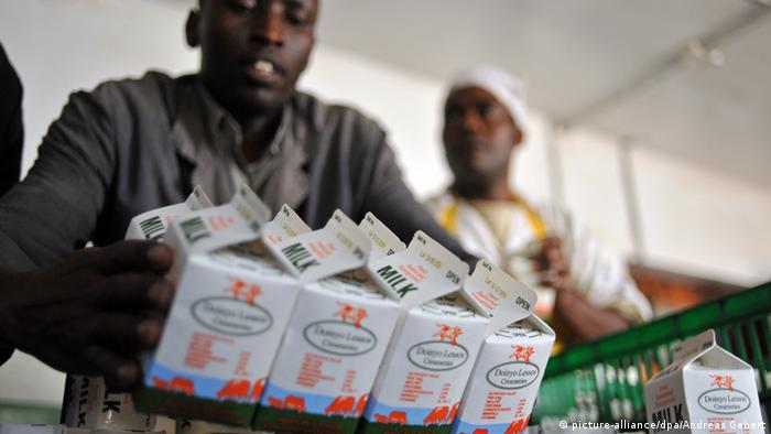 Kenyans buying milk at a supermarket