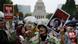 People hold placards and shout slogans as they protest against Japan's Prime Minister Shinzo Abe's security bill outside parliament in Tokyo August 30, 2015 (Photo: REUTERS/Thomas Peter) People hold placards and shout slogans as they protest against Japan's Prime Minister Shinzo Abe's security bill outside parliament in Tokyo August 30, 2015 (Photo: REUTERS/Thomas Peter)