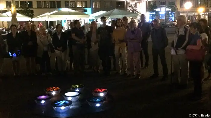 People gather around the Peace Lights on Gendarmenmarkt in Berlin
