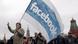 A man holds a Facebook flag at protests in Moscow (photo: EPA/MAXIM SHIPENKOV) A man holds a Facebook flag at protests in Moscow (photo: EPA/MAXIM SHIPENKOV)