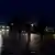 Migrants walking along Hungary highway at night