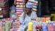 A shop owner makes a call at Oshodi market in Lagos