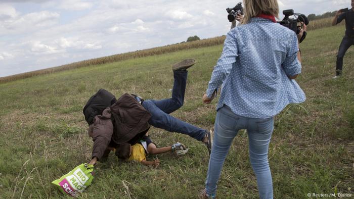 Hungarian journalist trips Syrian refugee