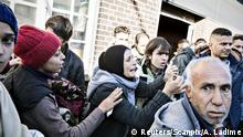 A group of migrants is seen at Padborg Station, Denmark, September 9, 2015, after they crossed the Danish/German border. Denmark's state-owned train operator DSB said trains are not running between Denmark and Germany due to exceptional passport checks at border. Many refugees are moving across Denmark from Germany to reach Sweden, which has one of Europe's most open policies toward asylum seekers. REUTERS/Alex Luka Ladime/Scanpix â€¨â€¨ATTENTION EDITORS - THIS IMAGE HAS BEEN SUPPLIED BY A THIRD PARTY. DENMARK OUT. NO COMMERCIAL OR EDITORIAL SALES IN DENMARK. NO COMMERCIAL SALES. THIS PICTURE IS DISTRIBUTED EXACTLY AS RECEIVED BY REUTERS, AS A SERVICE TO CLIENTS.
