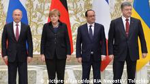 2571040 02/11/2015 February 11, 2015. From left: Russian President Vladimir Putin, German Chancellor Angela Merkel, French President Francois Hollande and Ukrainian President Petro Poroshenko pose for a group photo at Independence Palace in Minsk after restricted attendance peace talks on Ukraine held by the Russian, German, French and Ukrainian leaders. Viktor Tolochko/RIA Novosti