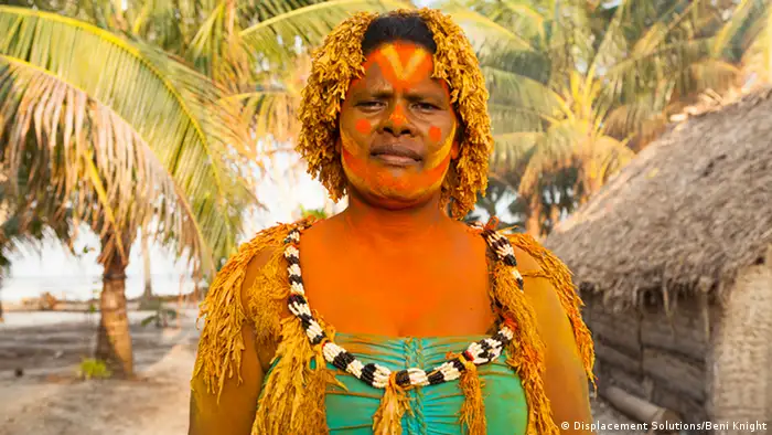 40-year-old Irene Manu with painted face on Luaniua, Ontong Java (Photo ...