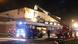 Fire engines in front of the hall with firefighters extinguishing the blaze. Photo: Rene Engmann/dpa Fire engines in front of the hall with firefighters extinguishing the blaze. Photo: Rene Engmann/dpa