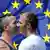 Two men in front of the European Union flag