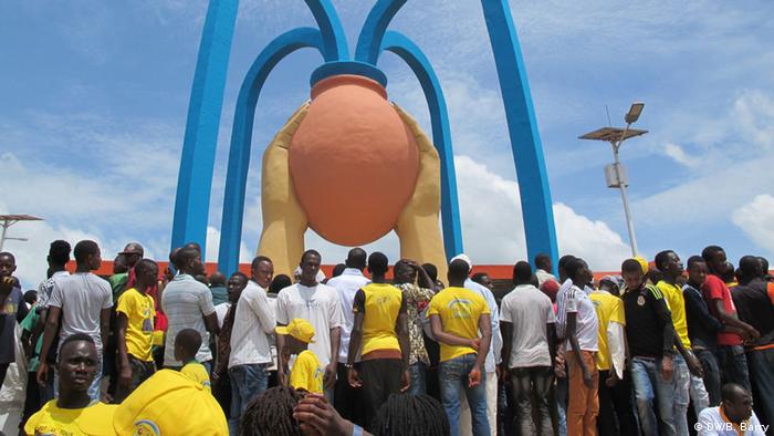 Supporters of President Alpha Conde at an election rally