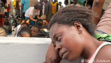 Description of photo: A woman waits for medical attention at the Dignity 1 Title: “The nightmare is over” Series Title in case there are several pictures about one topic: Navigating a sea of refugees Tags: Refugees, Dignity, MSF, rafts, Migrant boats, Libya Name of the photographer/or source : Karlos Zurutuza When was the pic taken? (October 2015) Where was the pic taken (Mediterranean sea) Description of the pic /occasion, situation when pic was taken, whom or what does the pic show? Many among the female refugees report sexual abuses at Libya´s infamous detention centres. Other than medical and psychological attention, the MSF crew also offers an AIDS test on board. “Most of them are traumatised and those who dare to speak tell gruesome stories,” MSF member on board Laura Pasquero told DW.
