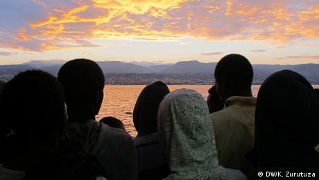 A group of sub-Saharan refugees overlook Reggio Calabria, southern Italy, from the Argos rescue vessel deck