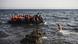 Barco com migrantes vindos da Turquia chega à ilha grega de Lesbos Barco com migrantes vindos da Turquia chega à ilha grega de Lesbos