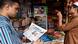 A man reads a newspaper in Bangladesh A man reads a newspaper in Bangladesh