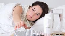 Young sick woman in bed and pills on the bedside table. #8380169 Copyright: Colourbox