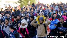 24.10.2015 Migrants walk towards the Austrian border after resting in a makeshift camp in the village of Sentilj, Slovenia, October 24, 2015. Slovenia called on the European Union to take immediate action to stem the flow of refugees and migrants into the 28-member bloc as thousands more arrived in the small Alpine country on Saturday. Some 58,000 migrants and refugees heading to Germany and Austria have arrived in Slovenia over the last week, shifting their route to the west after Hungary sealed its borders and prompting Slovenia to propose a meeting in Brussels on Sunday. Copyright: Reuters/L. Foeger