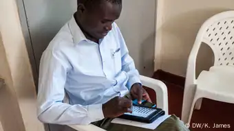 Man types on a tablet