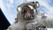 Astronaut Mike Hopkins, Expedition 38 Flight Engineer, is shown in this handout photo provided by NASA as he participates in the second of two spacewalks which took place on December 24, 2013, in this NASA handout image. The International Space Station celebrates its 15 year anniversary of human occupancy on November 2 +++ Copyright: Reuters/NASA