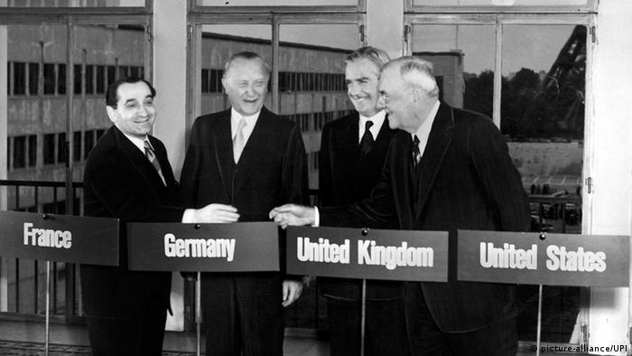 Standing in Paris in 1954, German Chancellor Konrad Adenauer stands alongside his French counterpart, Pierre Mendes, British Foreign Minister Sir Anthony Eden and US Secretary of State John Foster Dulles