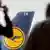 Two men observe a Lufthansa plane at the airport in Frankfurt
