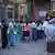 Voters queue in front of the Anawrahta Road polling station. (Photo: Rodion Ebbinghausen, DW)