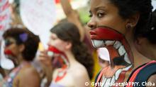 ARCHIV 2013 Women with their upper bodies painted pose as they take part in a protest against violence against women during the celebration of the International Women's Day on March 8, 2013, in Sao Paulo, Brazil. AFP PHOTO/YASUYOSHI CHIBA (Photo credit should read YASUYOSHI CHIBA/AFP/Getty Images) Getty Images/AFP/Y. Chiba