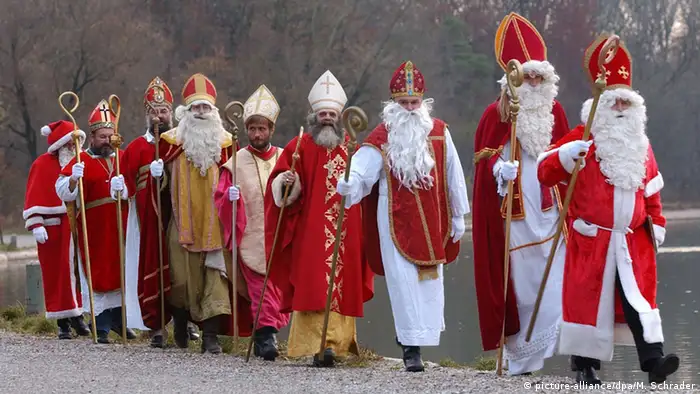 Several performers dressed as Saint Nicolas walking together in Munich, Germany (dpa)