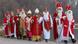 Several performers dressed as Saint Nicolas walking together in Munich, Germany (dpa)