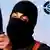 IS terroris Jihadi John, aka, Mohammed Emwaziholds up a large hunting knife, while his face, except for his eyes, is covered by a balaclava