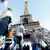 Tourists visit the Eifel Tower in Paris.