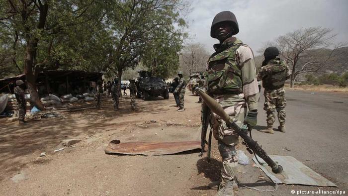 Nigerian soldiers man a checkpoint in Gwoza, Nigeria in April 2015