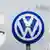 Greenpeace activists use the VW logo to spell "CO2" outside the company headquarters in Wolfsburg, Germany