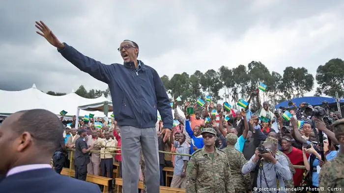 Rwanda's president Paul Kagame waves to crowds