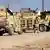 Das irakische Militär bringt seine Panzer und Truppen in Stellung. (Foto: picture-alliance/AP Photo)