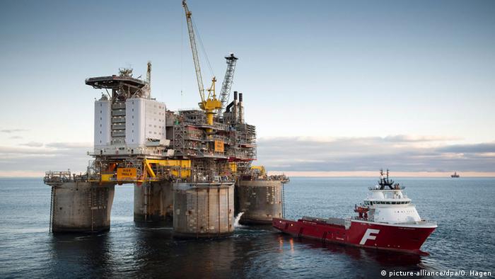 Statoil's Troll B oil platform next to a supply vessel in the North Sea