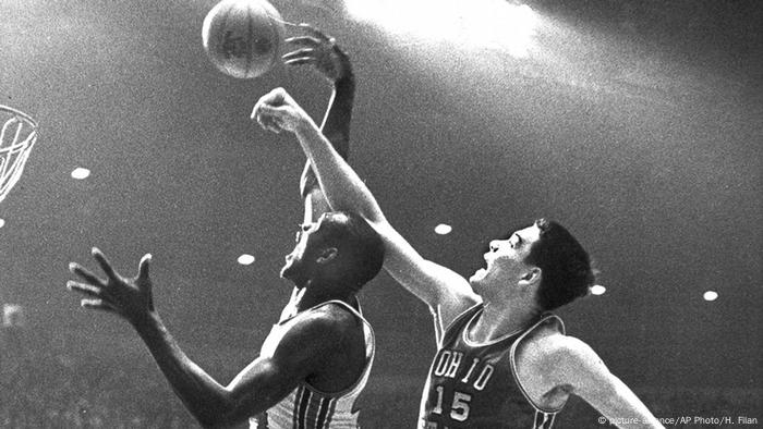 Elvin Hayes throws a hook under the basket and is interrupted by a defender