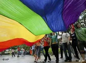Gay rights campaigners wave rainbow flag during parade in Hong Kong, photo