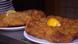 Two schnitzels on plates Two schnitzels on plates