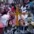 A cross in front of blurred people