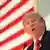 PräsidentschaftskandidatDonald Trump vor einer USA-Flagge (Foto: dpa)