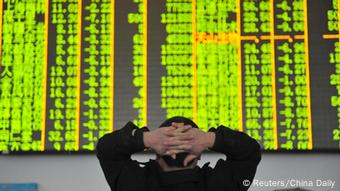 Chinese private investor in front of the board with exchange rates