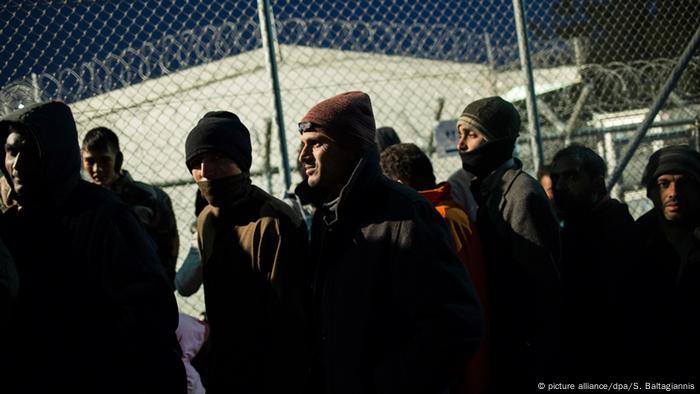 Refugees wait to be registered on Lesbos