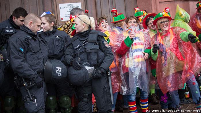 German police and Carnival revellers