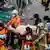 Rescuers carry a survivor from a collapsed building