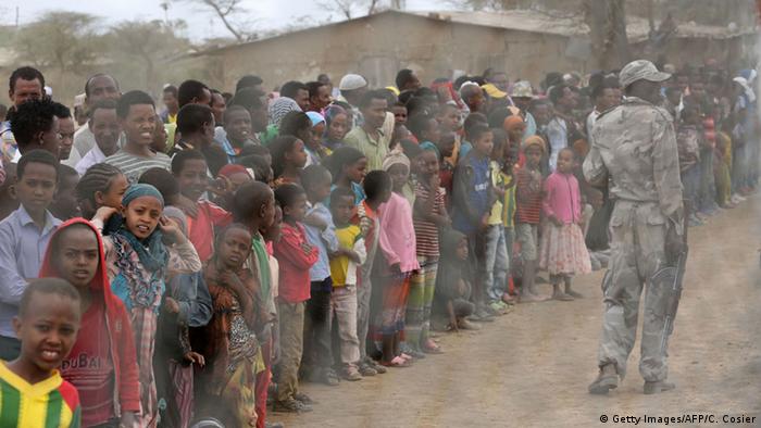 Local residents await the arrival of the UN secretary-general in Ogolcho in Ethiopia's drought affected Oromia region to tour various UN drought relief projects