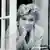 Marilyn Monroe looking out of a window (Copyright: Sam Shaw Inc./www.shawfamilyarchives.com)