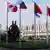 Штаб-квартира НАТО в Брюсселе с флагами стран-участниц у входа в здание