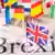 Надпись Brexit и британский флаг на фоне флагов других стран-членов ЕС