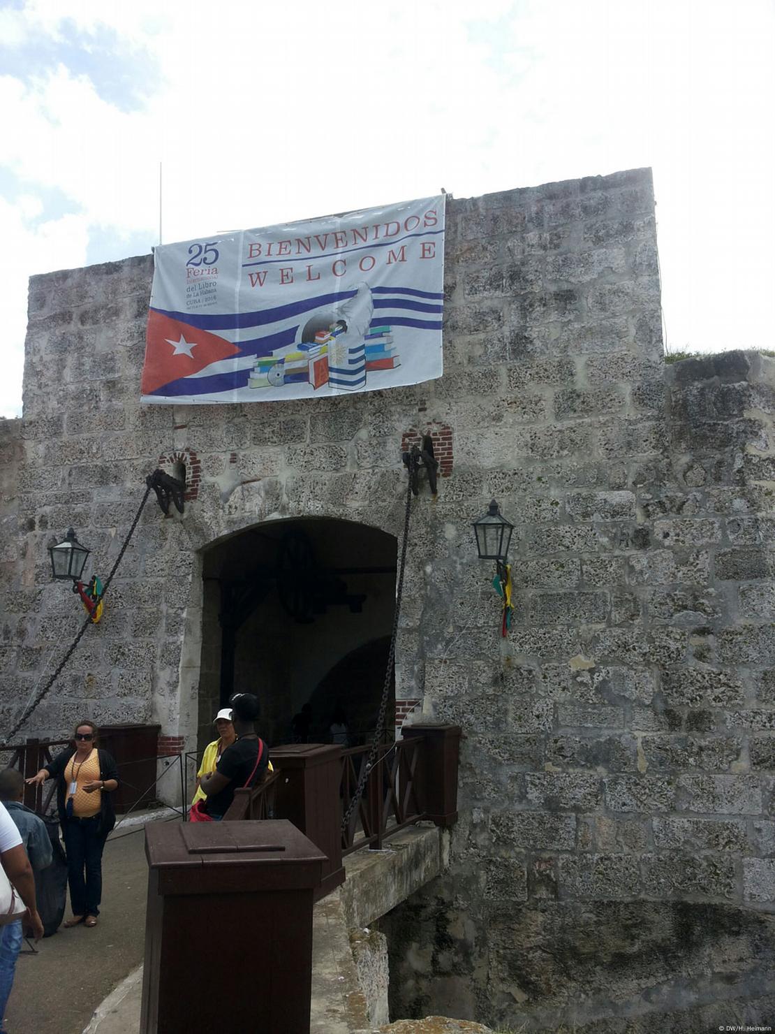 Cuba, Havana. Fortress wall and Cuban flag at San Carlos de