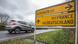 A car passes a road sign near the French-German-Luxembourgish border A car passes a road sign near the French-German-Luxembourgish border