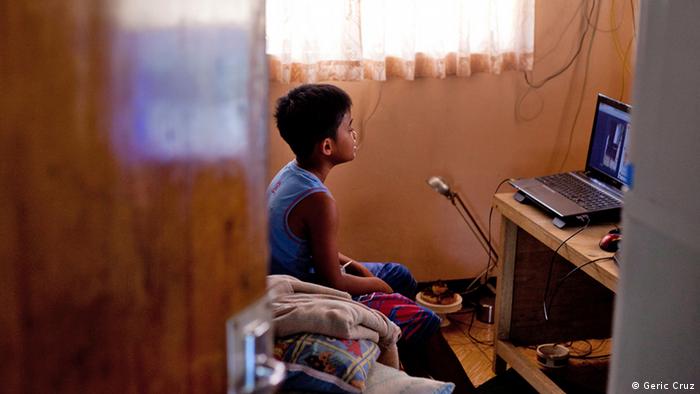 Gemma's son Vlad talks to his mother in Paris via a laptop